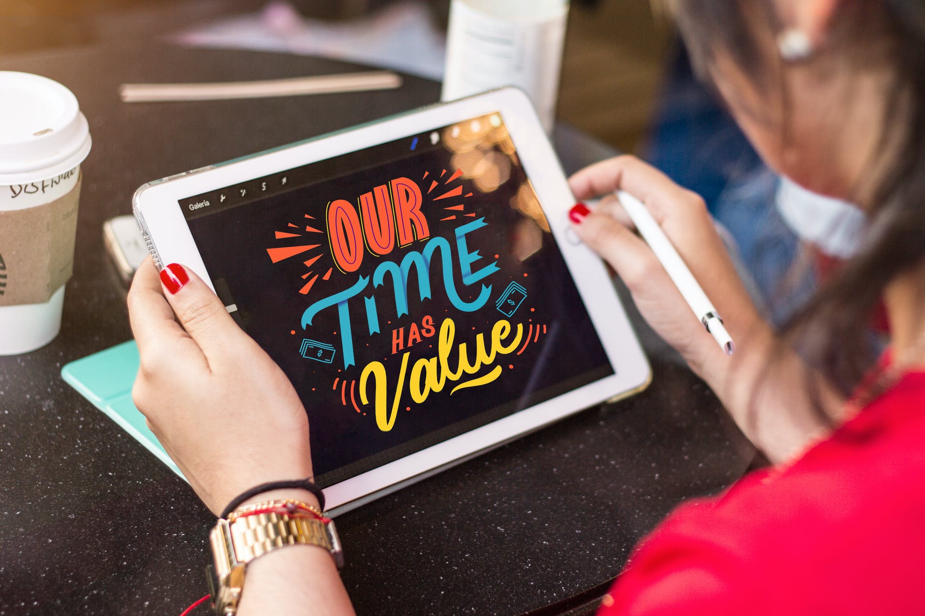 woman holding silver ipad